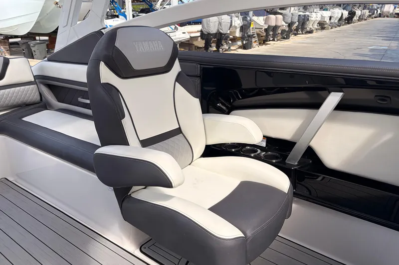 Slide: The Image of 2021 Yamaha Boats 275SD interior with luxurious seating and sleek design. - 29