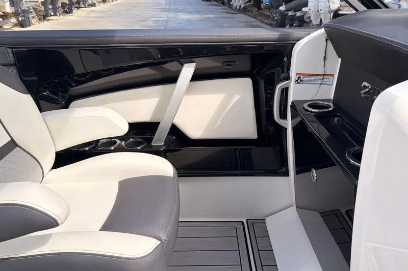 Slide: The Image of Interior of 2021 Yamaha Boats 275SD, featuring sleek seating and cup holders. - 30