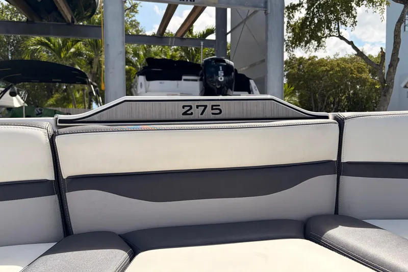Slide: The Image of 2021 Yamaha Boats 275SD interior seating with sleek design and modern upholstery. - 34