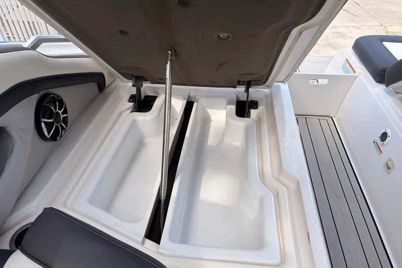 Slide: The Image of Open storage compartment on a 2021 Yamaha Boats 275SD, showcasing spacious interior design. - 40