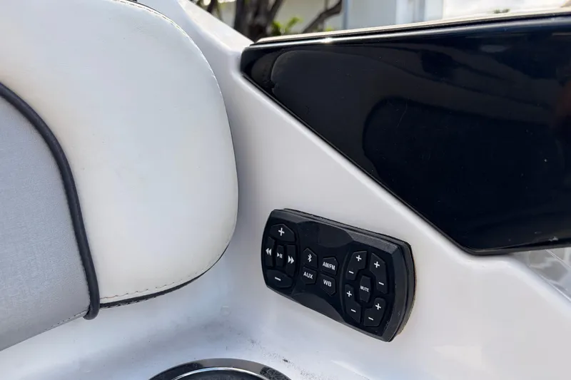 Slide: The Image of Control panel on 2021 Yamaha Boats 275SD, featuring audio and navigation buttons. - 43