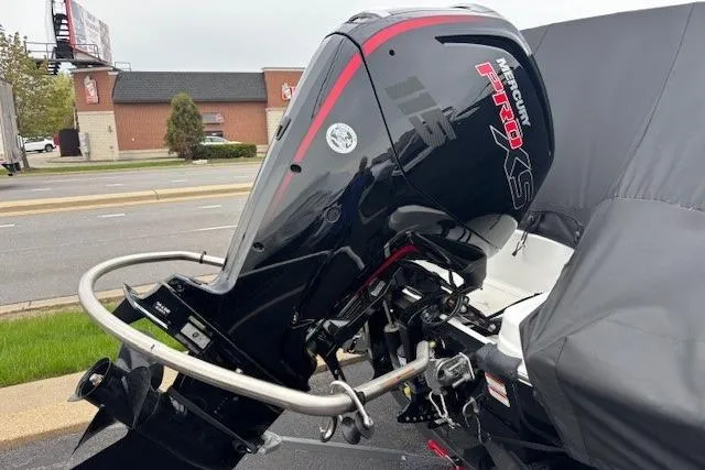 Slide: The Image of 2024 Tahoe T18 boat with Mercury Pro XS outboard motor, parked on a street. - 12