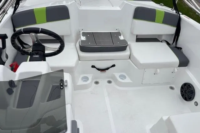 Slide: The Image of 2024 Tahoe T18 boat interior with seating, steering wheel, and storage compartments. - 30