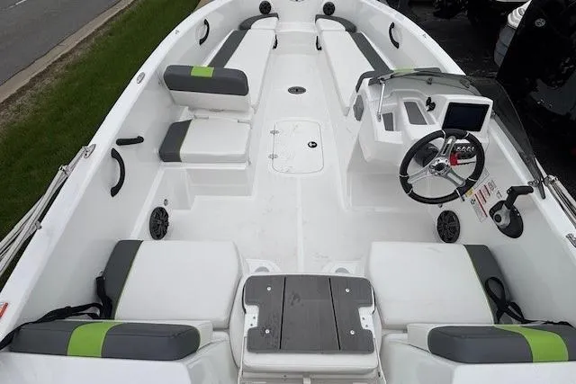 Slide: The Image of 2024 Tahoe T18 boat interior with seating, steering console, and modern design. - 32