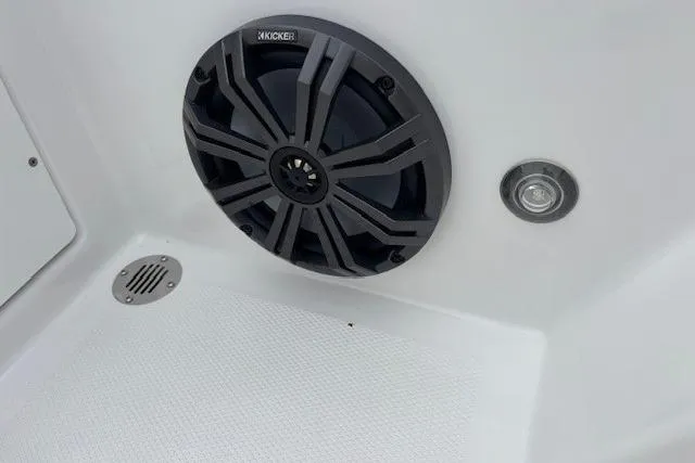 Slide: The Image of 2024 Tahoe T18 boat speaker and light detail on white interior surface. - 34