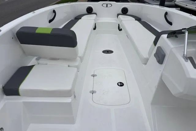 Slide: The Image of 2024 Tahoe T18 boat interior with white and gray seating, modern design. - 35