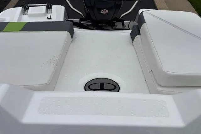 Slide: The Image of 2024 Tahoe T18 boat interior with white cushioned seating and sleek design. - 39