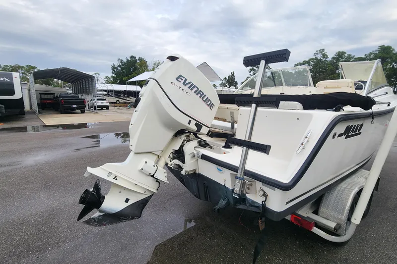 Slide: The Image of 2006 Mako 216 Dual Console boat with Evinrude engine on trailer. - 5