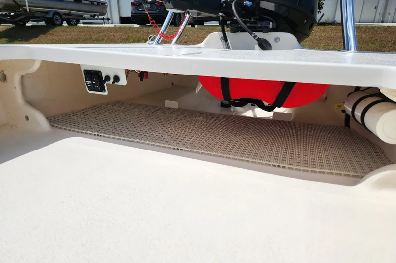 Slide: The Image of 2020 Spear Boatworks Evergladez storage compartment with safety equipment and wiring. - 11