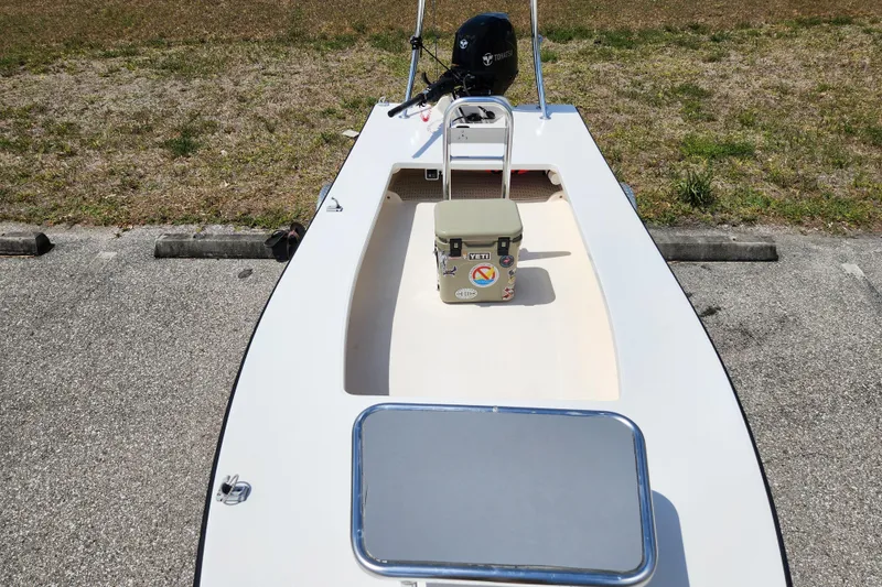 Slide: The Image of 2020 Spear Boatworks Evergladez boat with Yeti cooler on deck, parked on pavement. - 15