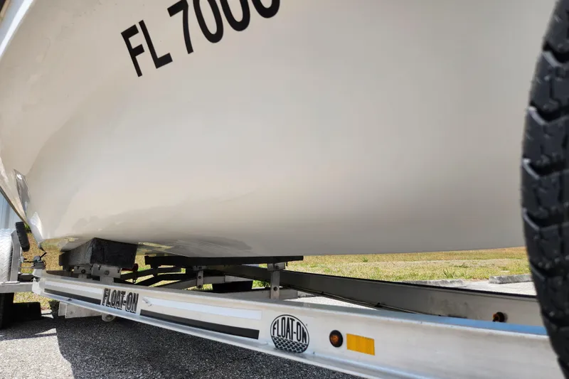 Slide: The Image of 2020 Spear Boatworks Evergladez on a Float-On trailer, close-up view. - 17