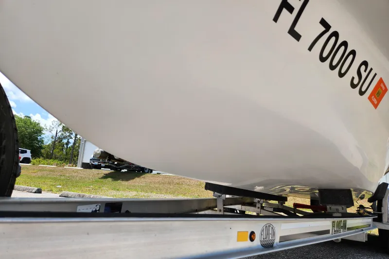 Slide: The Image of 2020 Spear Boatworks Evergladez on trailer, showing hull and registration number. - 18