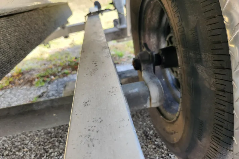 Slide: The Image of Close-up of a 2020 Spear Boatworks Evergladez trailer wheel and frame. - 19