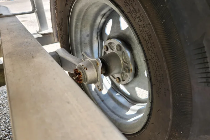 Slide: The Image of Trailer wheel and axle of 2020 Spear Boatworks Evergladez boat. - 20