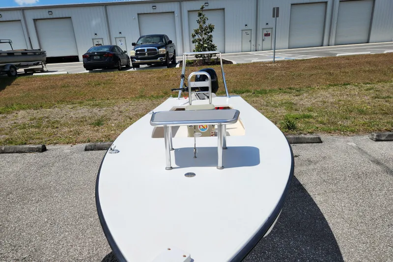 Slide: The Image of 2020 Spear Boatworks Evergladez in parking lot, front view with clear sky background. - 7
