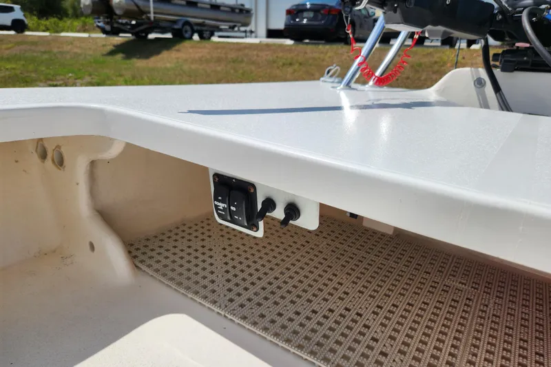 Slide: The Image of 2020 Spear Boatworks Evergladez interior with control panel and textured flooring. - 8