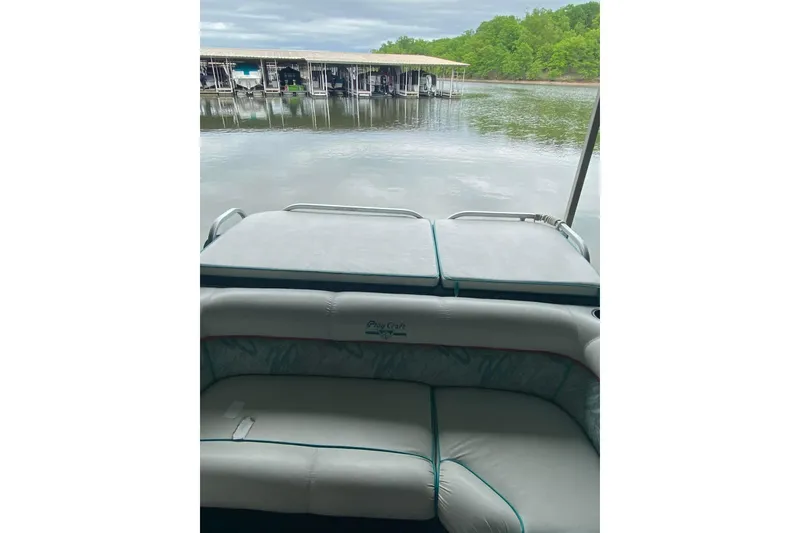 Slide: The Image of 1995 PlayCraft Powertoon 26 pontoon boat interior with lake view. - 19
