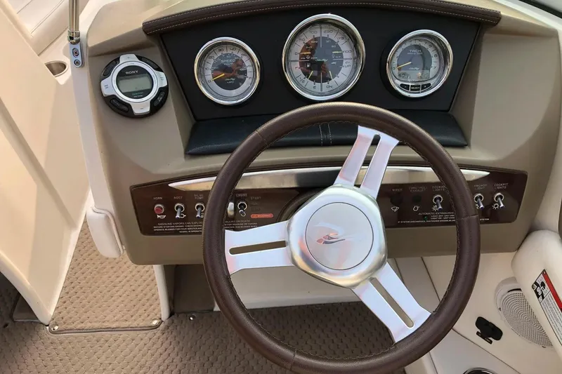 Slide: The Image of Steering wheel and dashboard of 2012 Sea Ray SLX 230 boat. - 10