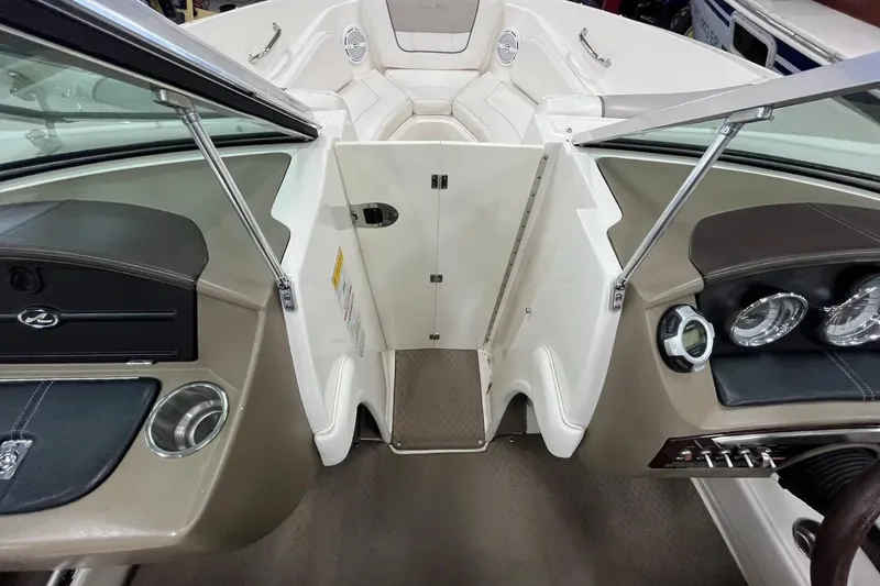 Slide: The Image of Interior view of 2012 Sea Ray SLX 230 boat, featuring dashboard and seating area. - 20