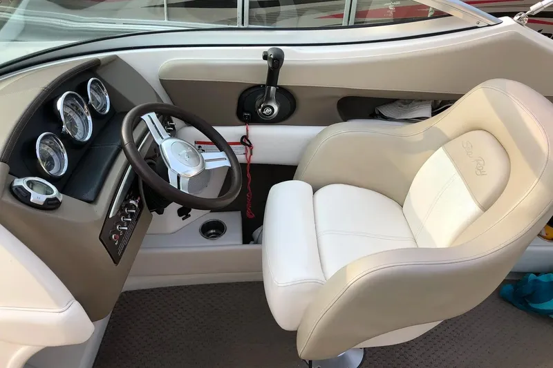 Slide: The Image of Cockpit of 2012 Sea Ray SLX 230 boat with steering wheel and gauges. - 6