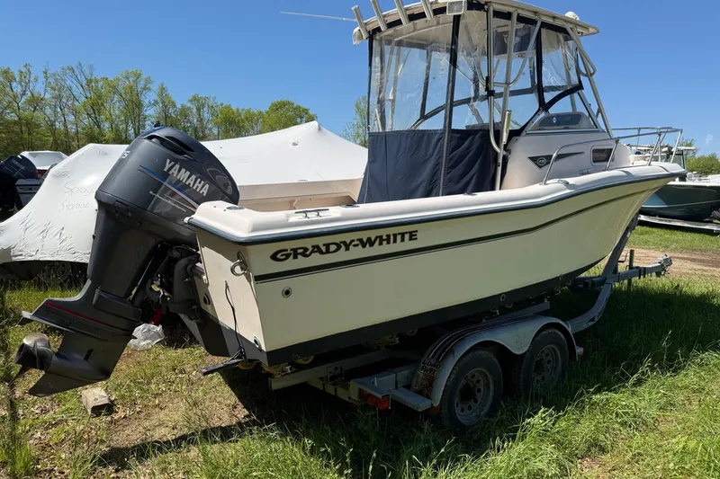 Slide: The Image of 2002 Grady-White Adventure 208 boat with Yamaha outboard motor on trailer. - 2