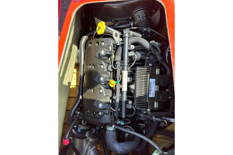 Slide: The Image of 2012 Sea-Doo GTI SE 130 engine compartment, showcasing internal components and wiring. - 11