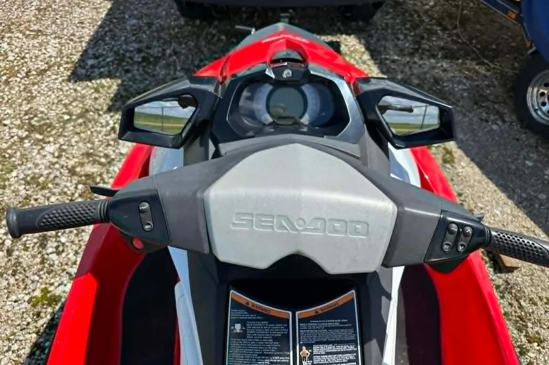 Slide: The Image of 2012 Sea-Doo GTI SE 130 handlebars and dashboard, featuring control buttons and mirrors. - 6
