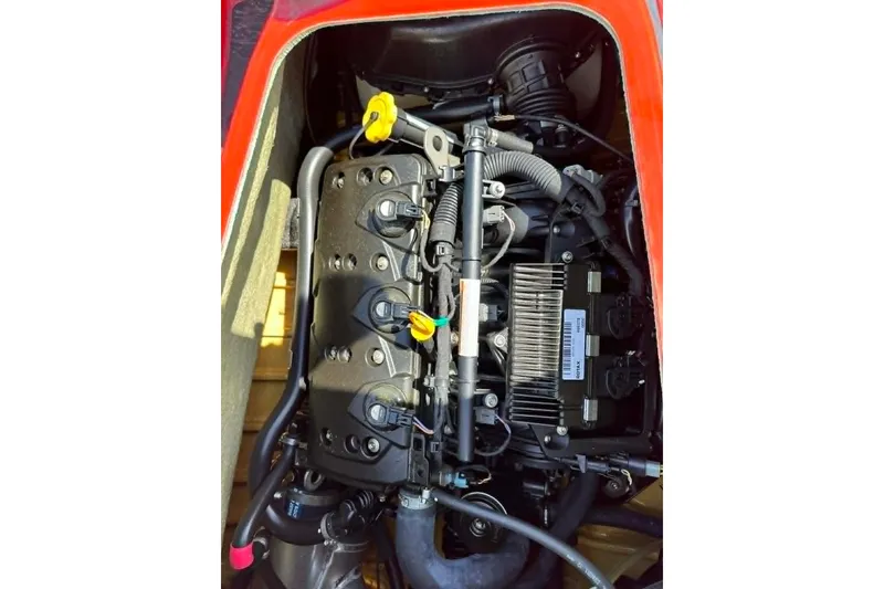 Slide: The Image of Engine compartment of a 2012 Sea-Doo GTI SE 130 watercraft, showcasing internal components. - 8