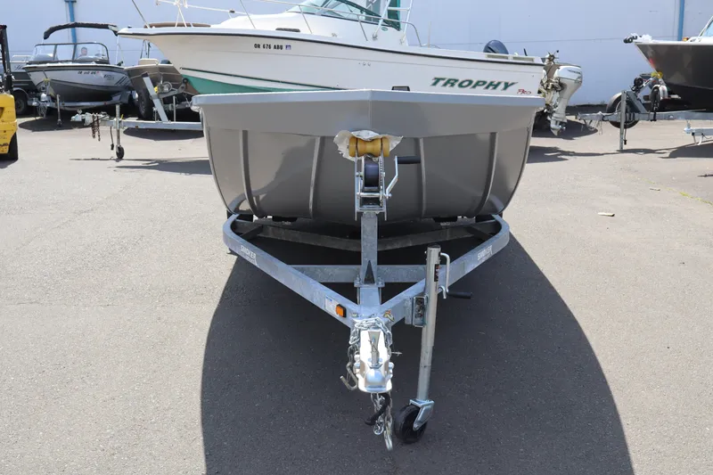 Slide: The Image of 2026 Smoker Craft Sportsman 1866 boat on trailer, parked outdoors. - 3