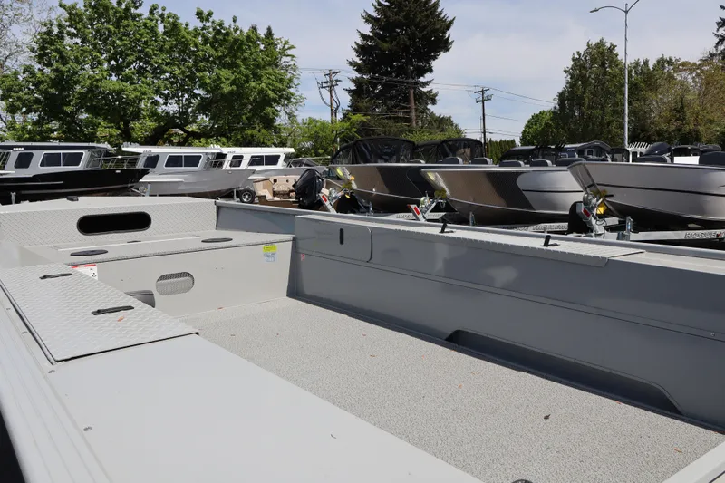 Slide: The Image of 2026 Smoker Craft Sportsman 1866 boat interior, showcasing spacious deck and storage compartments. - 5