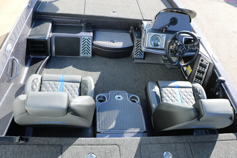 Slide: The Image of 2027 Caymas 201 Pro boat interior with dual seats, steering wheel, and control panel. - 20