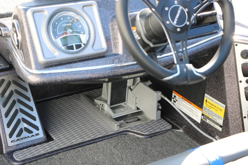 Slide: The Image of 2027 Caymas 201 Pro boat dashboard with steering wheel and instrument panel. - 33