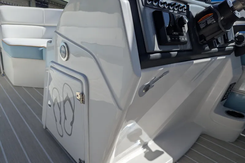Slide: The Image of 2026 Trifecta CS 22RF boat interior with control panel and seating area. - 13