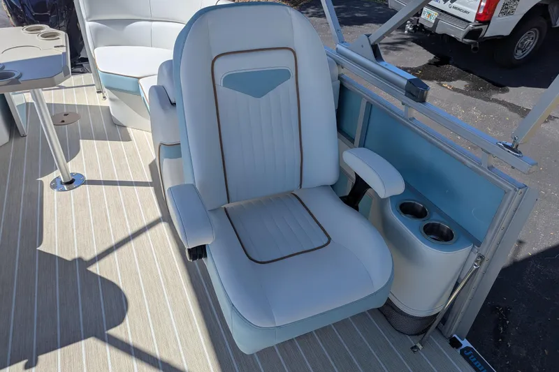 Slide: The Image of Captain's chair on 2026 Trifecta CS 22RF boat, featuring cup holders and sleek design. - 14
