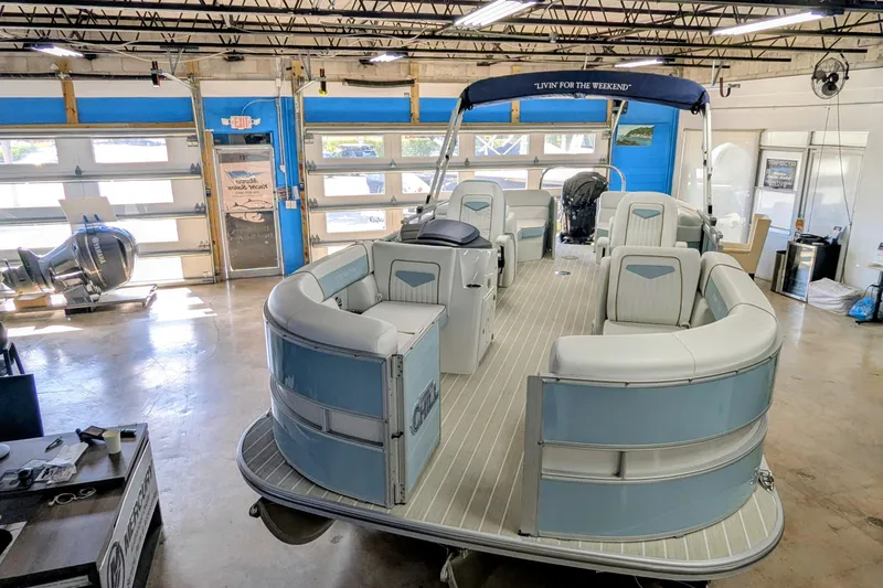 Slide: The Image of 2026 Trifecta CS 22RF pontoon boat in a workshop setting. - 15