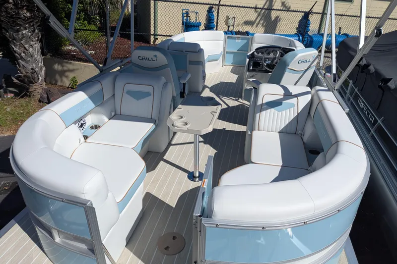 Slide: The Image of Luxurious 2026 Trifecta CS 22RF pontoon boat with spacious seating and modern design. - 16