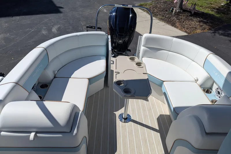 Slide: The Image of 2026 Trifecta CS 22RF pontoon boat interior with plush seating and modern design. - 17
