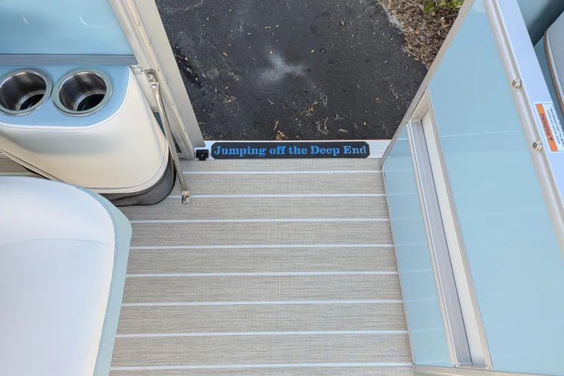 Slide: The Image of 2026 Trifecta CS 22RF boat interior with cup holders and "Jumping off the Deep End" text. - 18