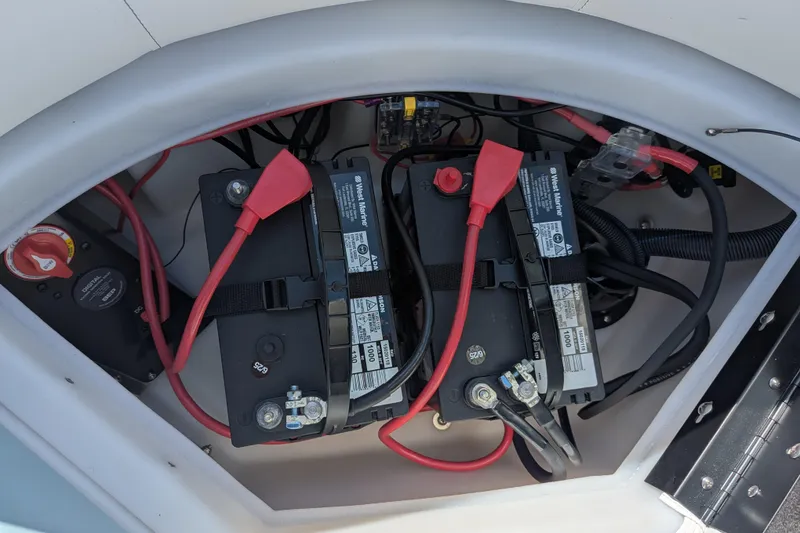 Slide: The Image of Battery compartment of 2026 Trifecta CS 22RF with dual marine batteries and wiring. - 21