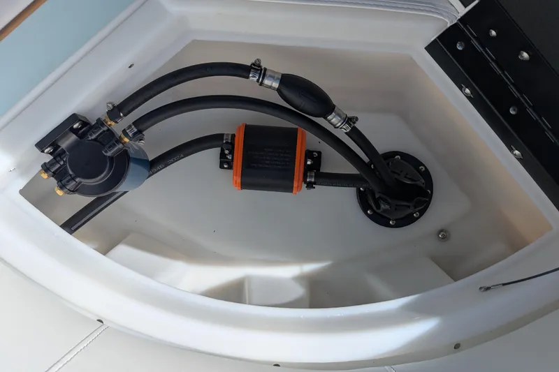 Slide: The Image of 2026 Trifecta CS 22RF boat fuel system with hoses and pump components. - 22