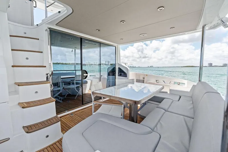 Slide: The Image of Luxurious 2019 Azimut yacht interior with seating, table, and ocean view. - 11