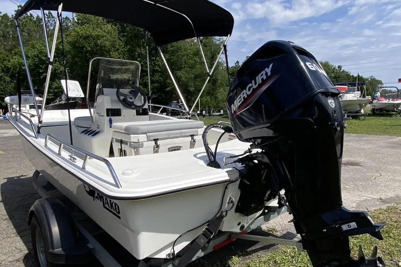 Slide: The Image of 2021 Mako Pro Skiff 15 CC boat with Mercury engine on trailer. - 3