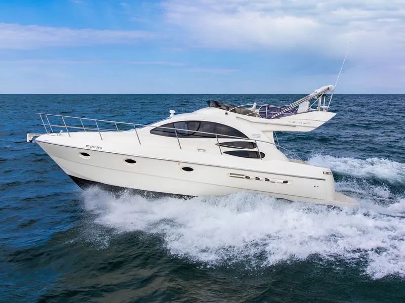 Slide: The Image of 2004 Azimut 39 Flybridge yacht cruising on open sea. - 2