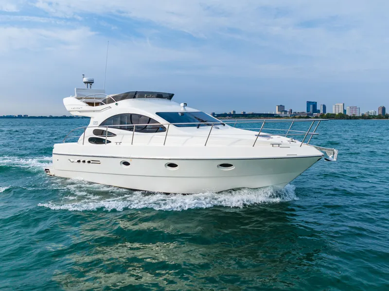 Slide: The Image of Azimut 39 Flybridge 2004 yacht cruising near city skyline. - 20