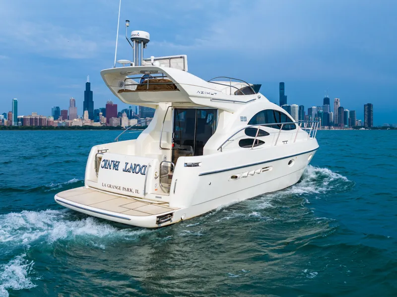 Slide: The Image of 2004 Azimut 39 Flybridge yacht cruising on open water. - 21