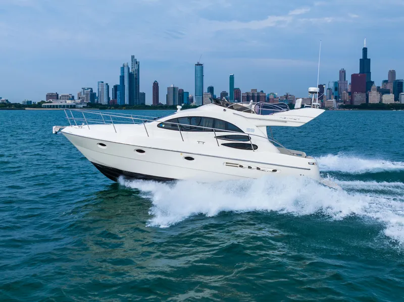 Slide: The Image of Azimut 39 Flybridge 2004 yacht with white interior and ocean view. - 28