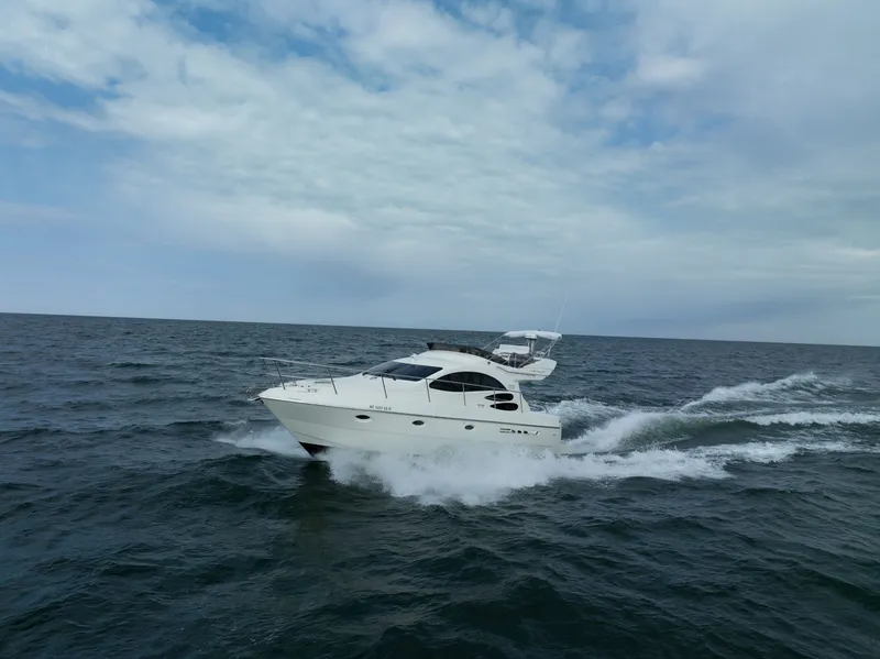 Slide: The Image of Azimut 39 Flybridge 2004 cruising on open sea under cloudy sky. - 3