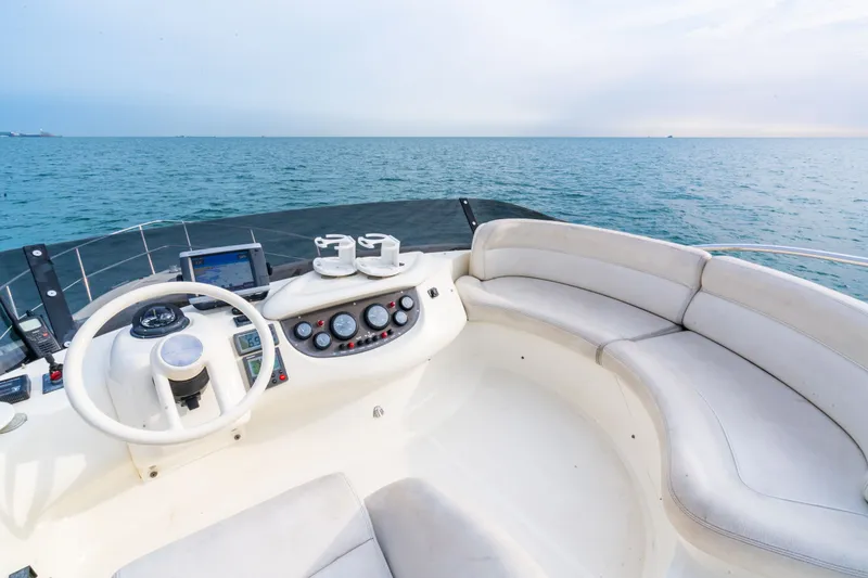 Slide: The Image of Interior view of 2004 Azimut 39 Flybridge helm. - 32