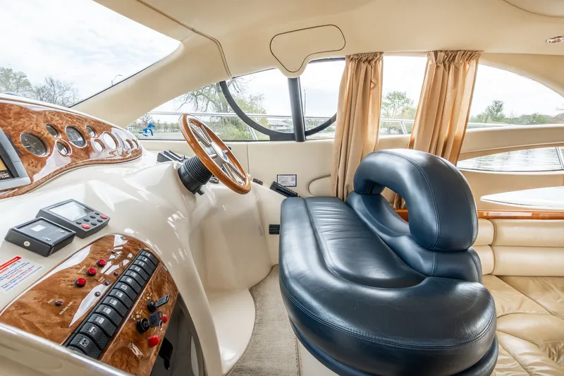 Slide: The Image of Interior of a 2004 Azimut 39 Flybridge yacht with luxurious cockpit. - 35