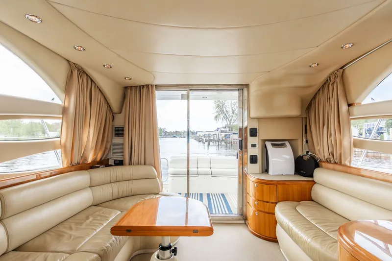 Slide: The Image of Interior of 2004 Azimut 39 Flybridge yacht with luxurious leather seating. - 42